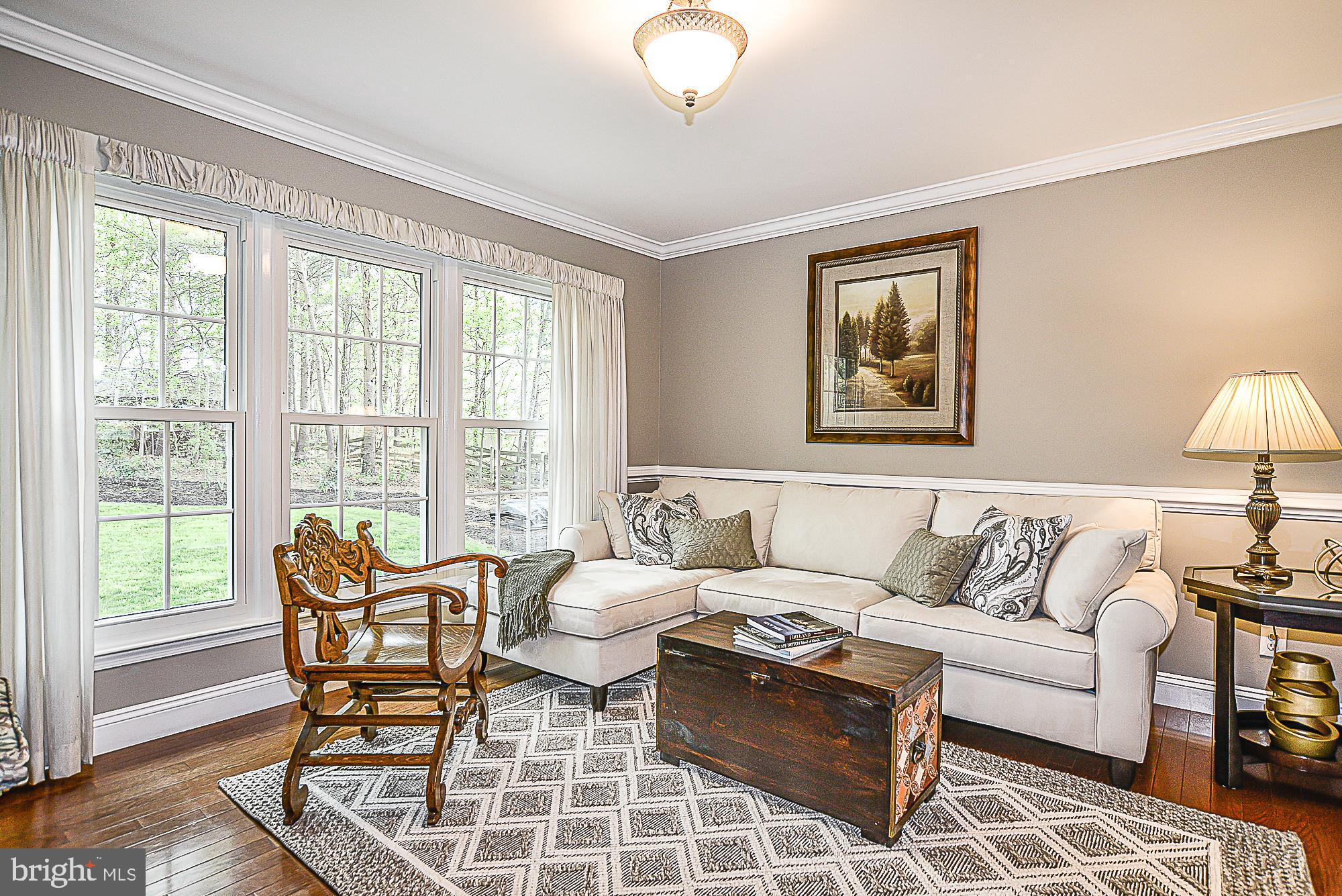 9291 Davis Drive Lorton, VA 22079 - Photo 15 of 57 Living room with crown molding and chair rail
