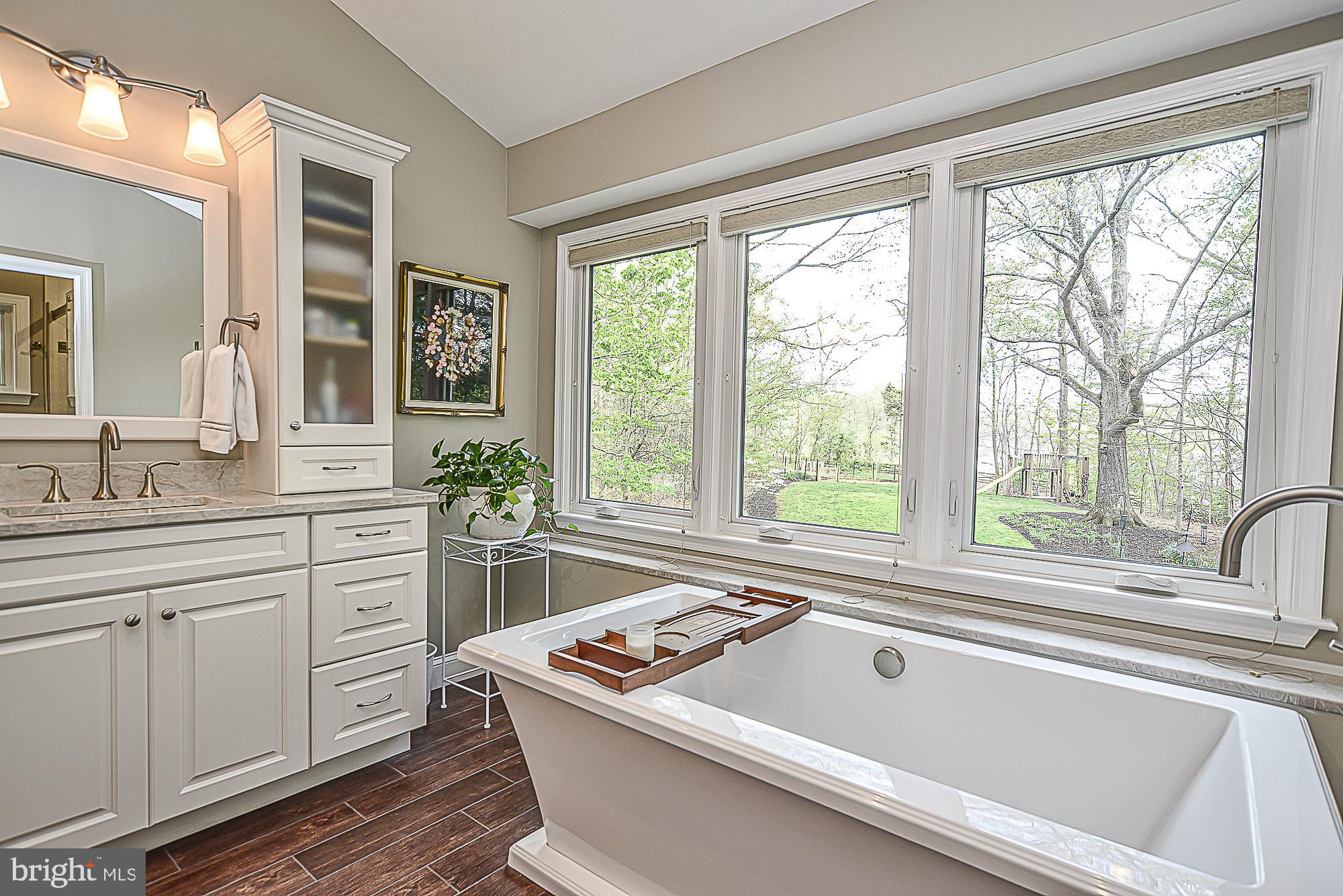 9291 Davis Drive Lorton, VA 22079 - Photo 29 of 57 Custom vanity and woodlook tile flooring