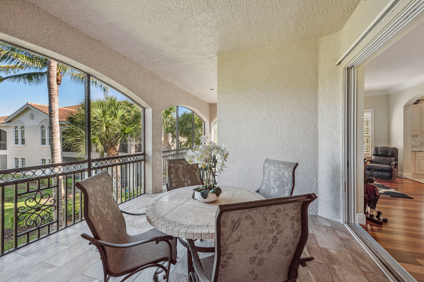 3189 Aviamar Circle, Unit 202 Naples, FL 34114 - Photo 25 of 50 a view of a dining room with furniture window and wooden floor