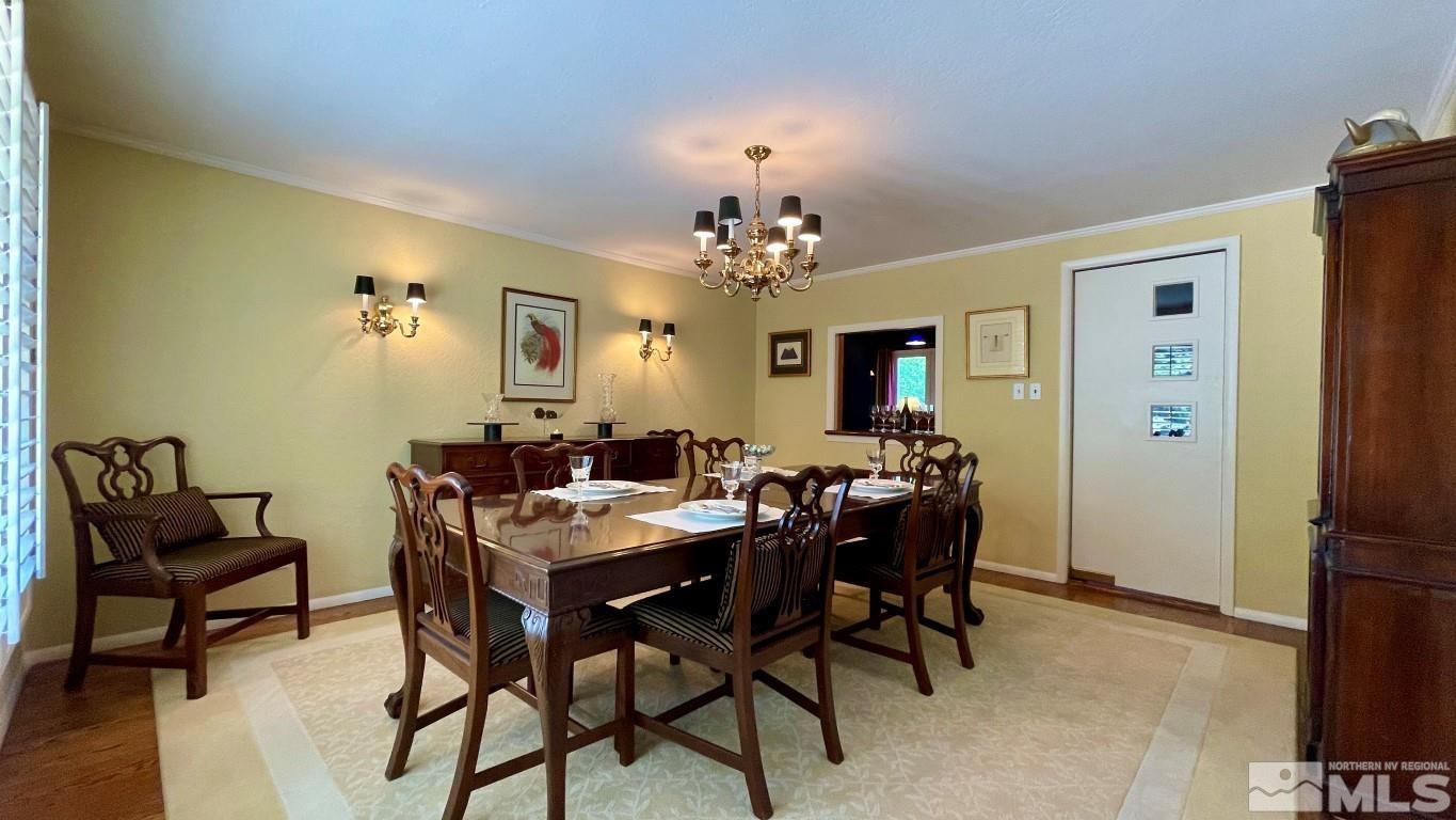 1441 Belford Road Reno, NV 89509 - Photo 21 of 40 a view of a dining room with furniture and a chandelier