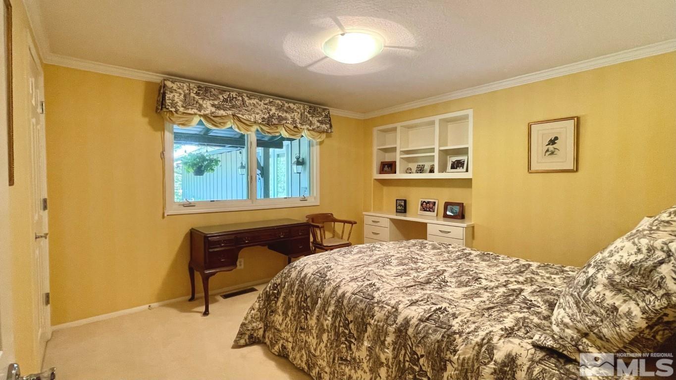 1441 Belford Road Reno, NV 89509 - Photo 28 of 40 a bedroom with a bed and a window