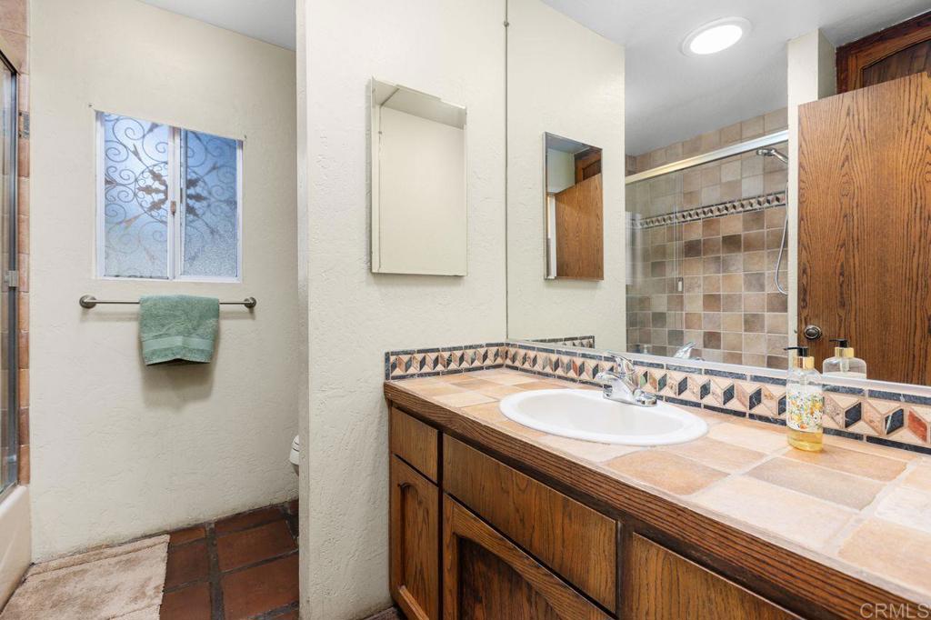 29560 Lilac Road Valley Center, CA 92082 - Photo 24 of 43 a bathroom with a sink and a mirror