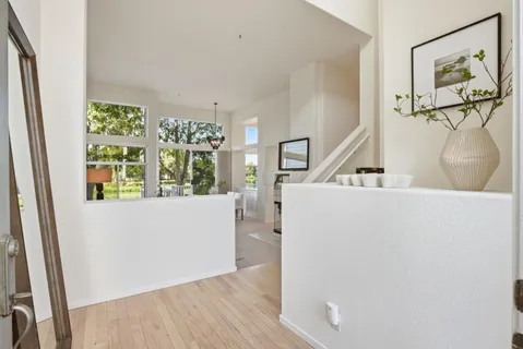 a view of living room with furniture and natural light