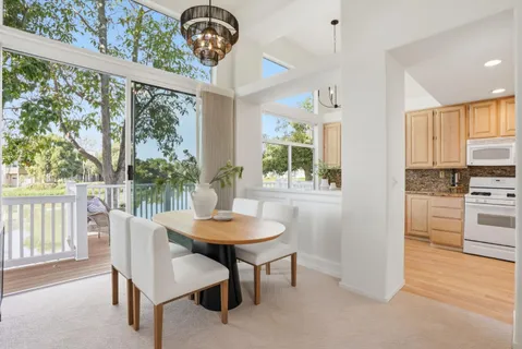 a view of a dining room with furniture window and outside view