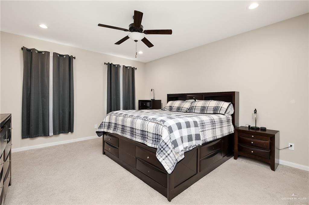 6323 Cascada Bnd Road McAllen, TX 78504 - Photo 15 of 26 a bedroom with a bed dresser and a window
