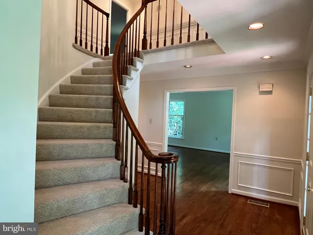 a bathroom with a sink toilet vanity and shower
