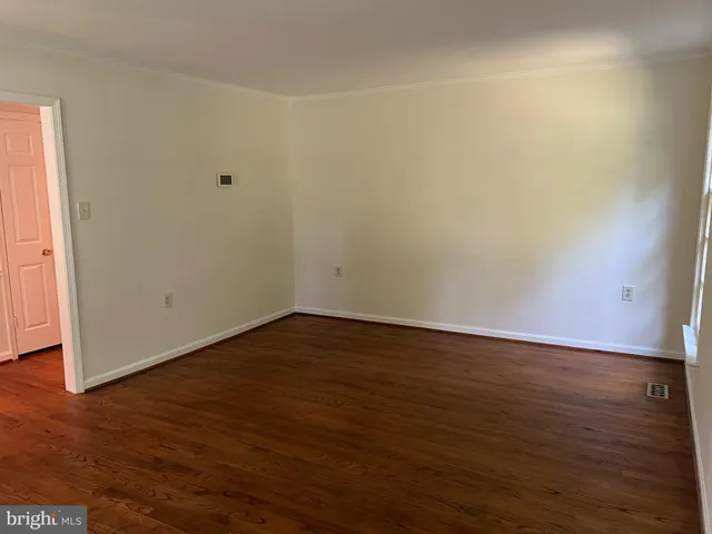 a bathroom with a sink mirror and toilet