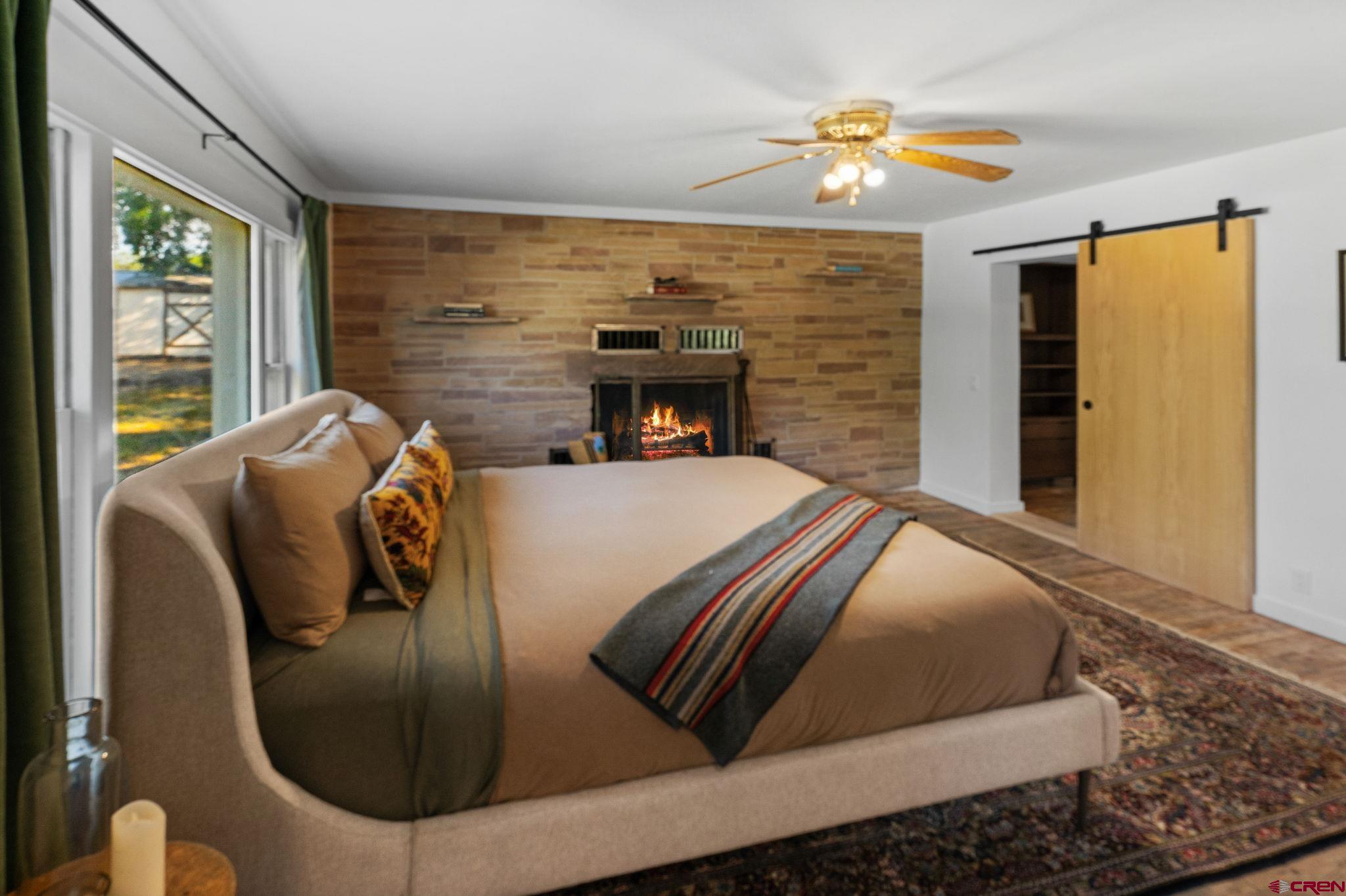 554 Main Street Nucla, CO 81424 - Photo 3 of 44 a bed sitting in a bedroom next to a window