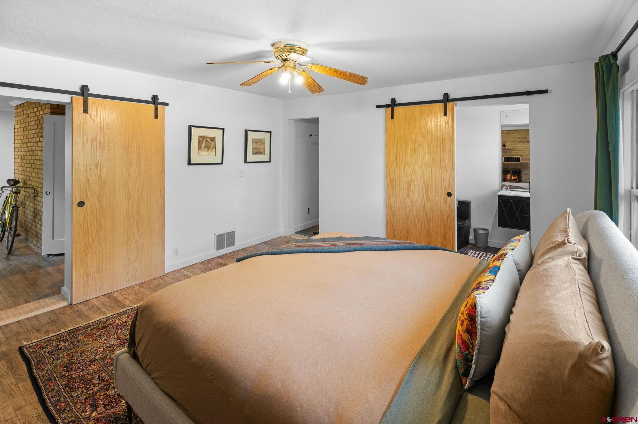 554 Main Street Nucla, CO 81424 - Photo 5 of 44 a bedroom with a bed and a chandelier