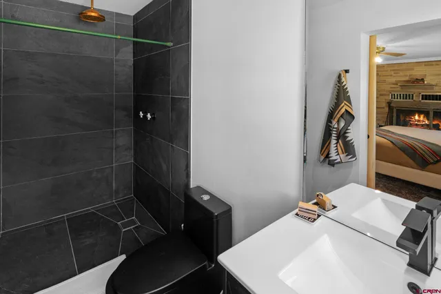 a bathroom with a sink and mirror