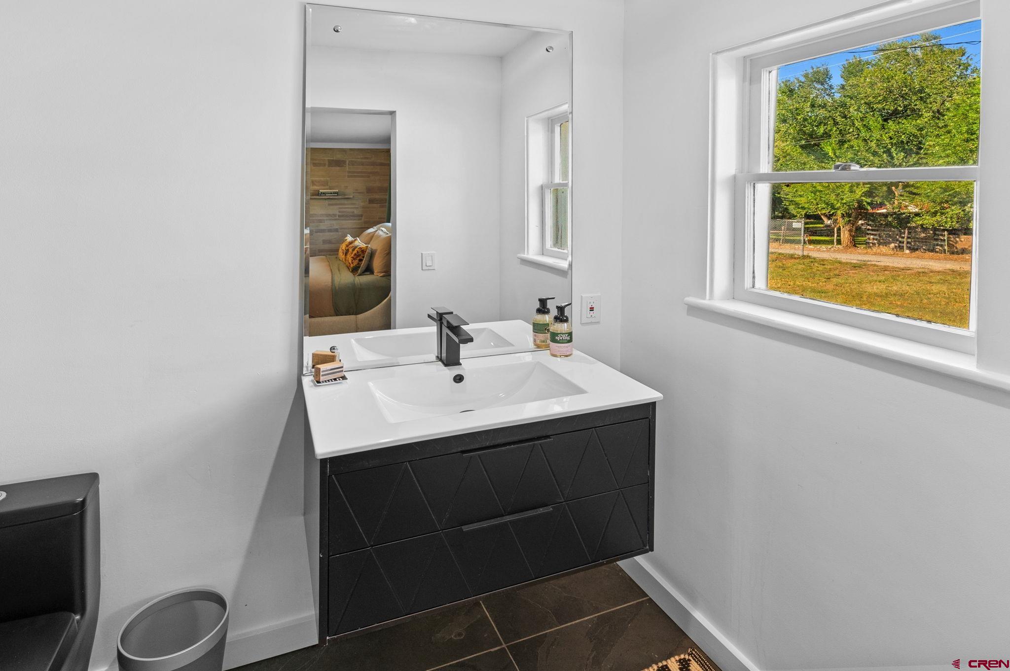 554 Main Street Nucla, CO 81424 - Photo 7 of 44 a bathroom with a sink and a mirror
