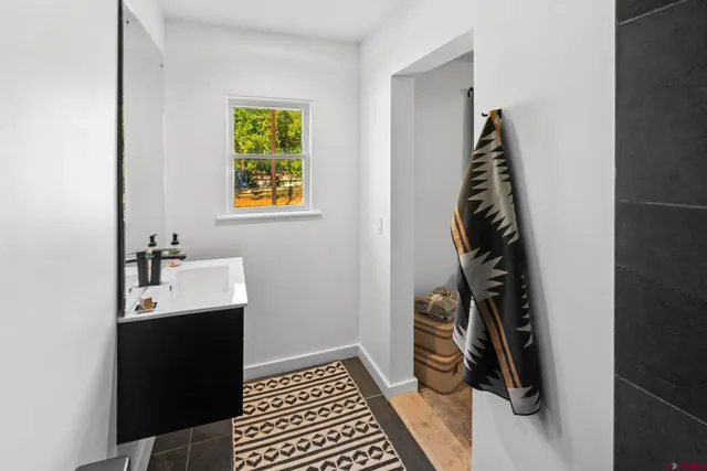 a bathroom with a sink and a window