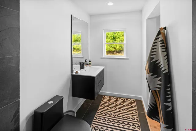 a view of a bedroom with natural light