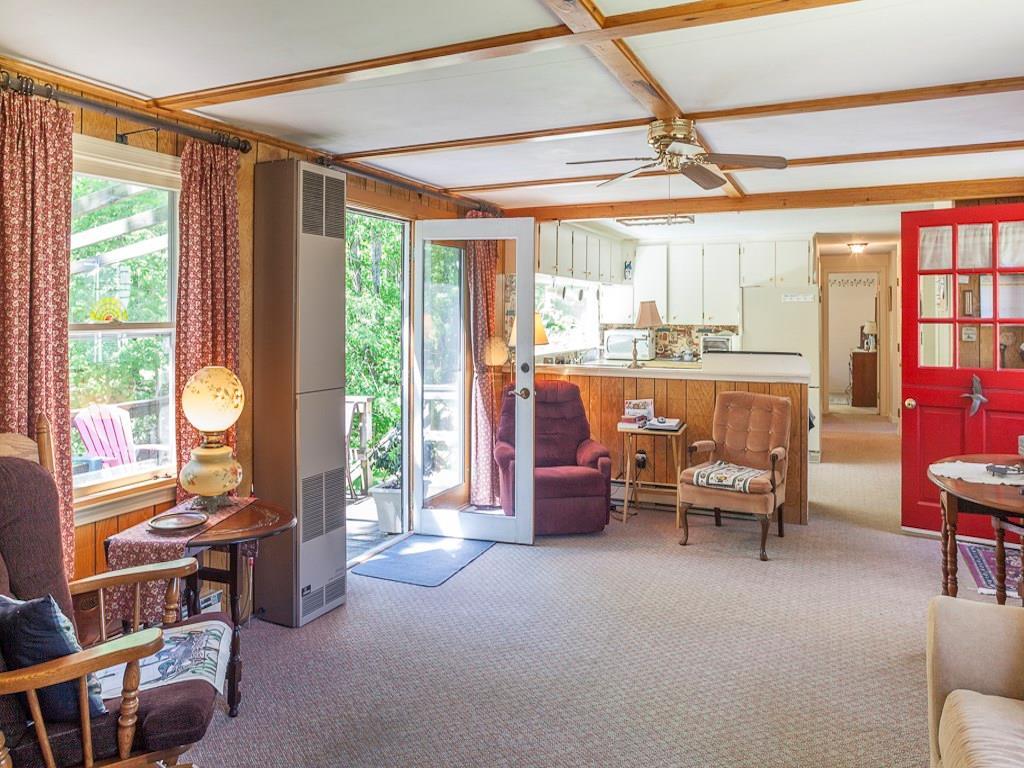 15 Windmill Acres Road, Unit ACRES York, ME 03909 - Photo 9 of 24 The kitchen is open to the large...