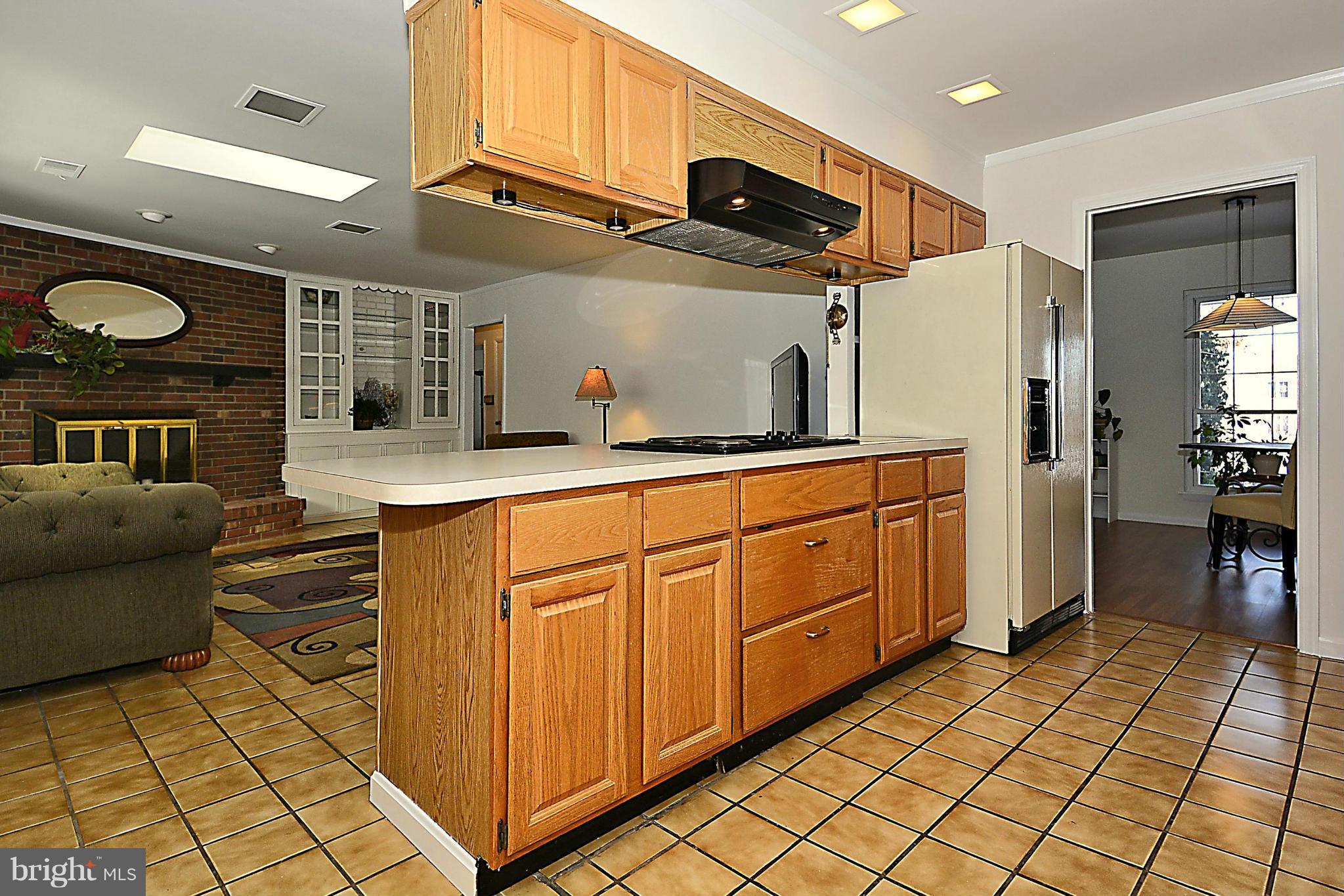 18506 Cabin Road Triangle, VA 22172 - Photo 9 of 30 Open Kitchen with Cooktop on Spacious Island