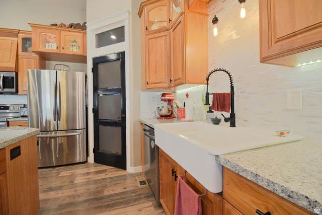 656 South Bullion Canyon Road Marysvale, UT 84750 - Photo 13 of 57 Kitchen with stainless steel appliances, decorative backsplash, glass insert cabinets, and light stone countertops