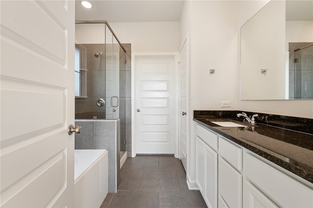 2415 Rooke Road Bryan, TX 77807 - Photo 29 of 36 a bathroom with a sink and a shower
