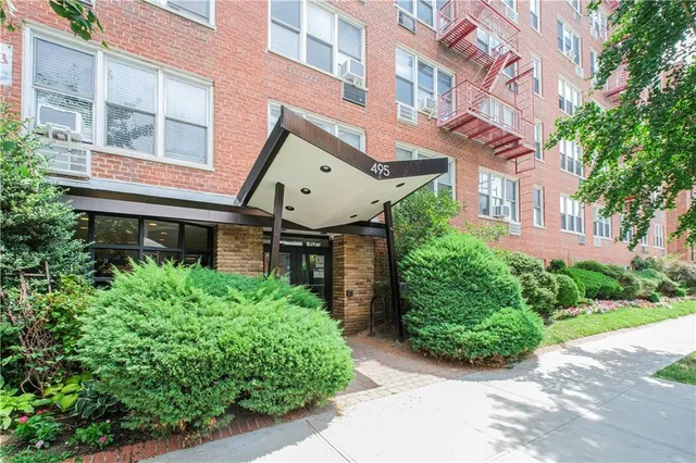 a front view of a multi story residential apartment buildings