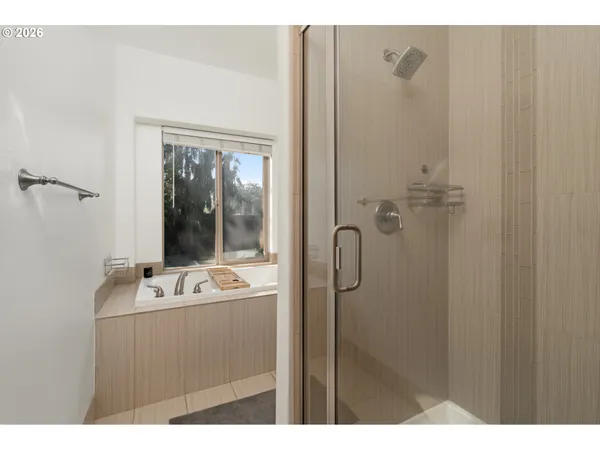 a bathroom with a sink and mirror with toilet