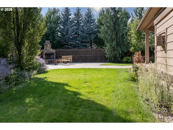 a view of a house with a yard patio and swimming pool