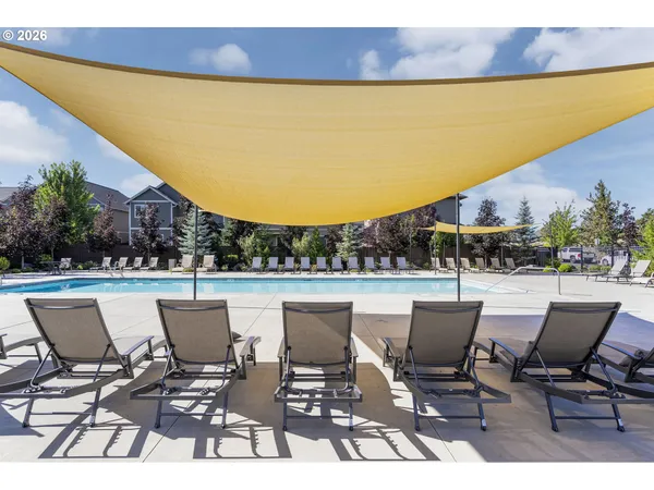 a view of balcony with outdoor seating and city view