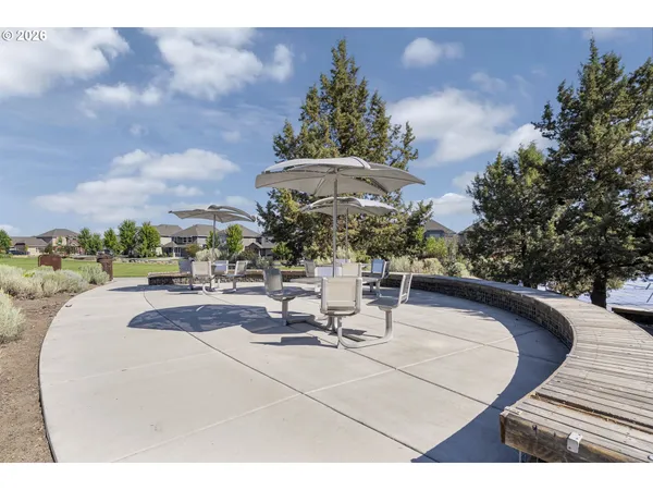 a view of a swimming pool with outdoor seating