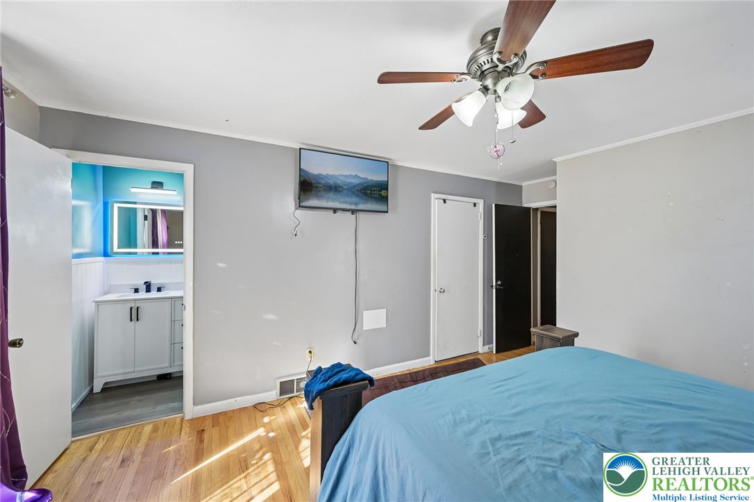 2649 Nottingham Road Bethlehem, PA 18017 - Photo 24 of 49 Hardwood floors and a ceiling fan enhance this cozy bedroom with an adjoining private bath.