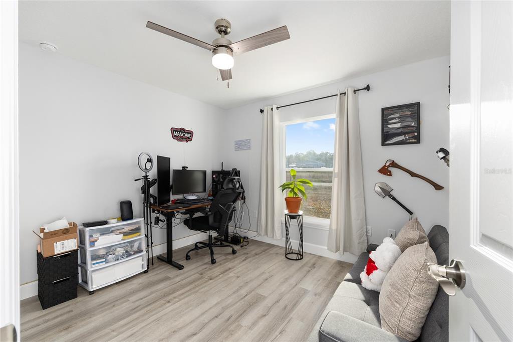 3597 Southwest 151st Avenue Ocala, FL 34481 - Photo 22 of 35 a workspace with furniture and wooden floor