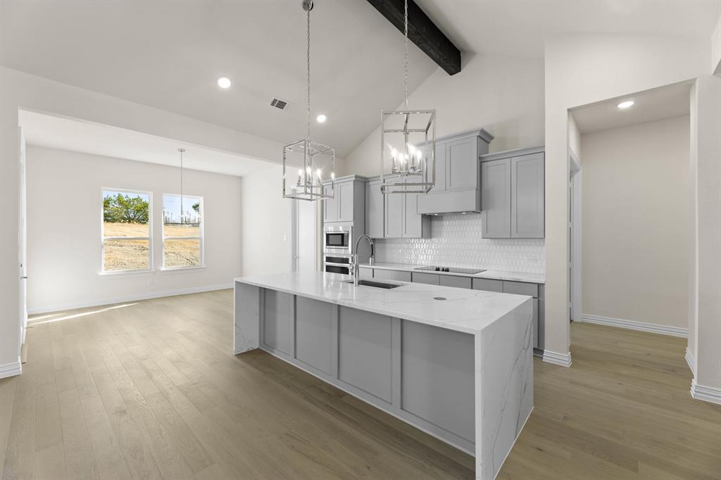 325 Slimp Bluff Azle, TX 76020 - Photo 13 of 25 a kitchen with a sink window and cabinets