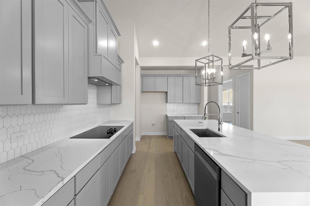 325 Slimp Bluff Azle, TX 76020 - Photo 14 of 25 a kitchen with stainless steel appliances granite countertop a sink counter space and cabinets