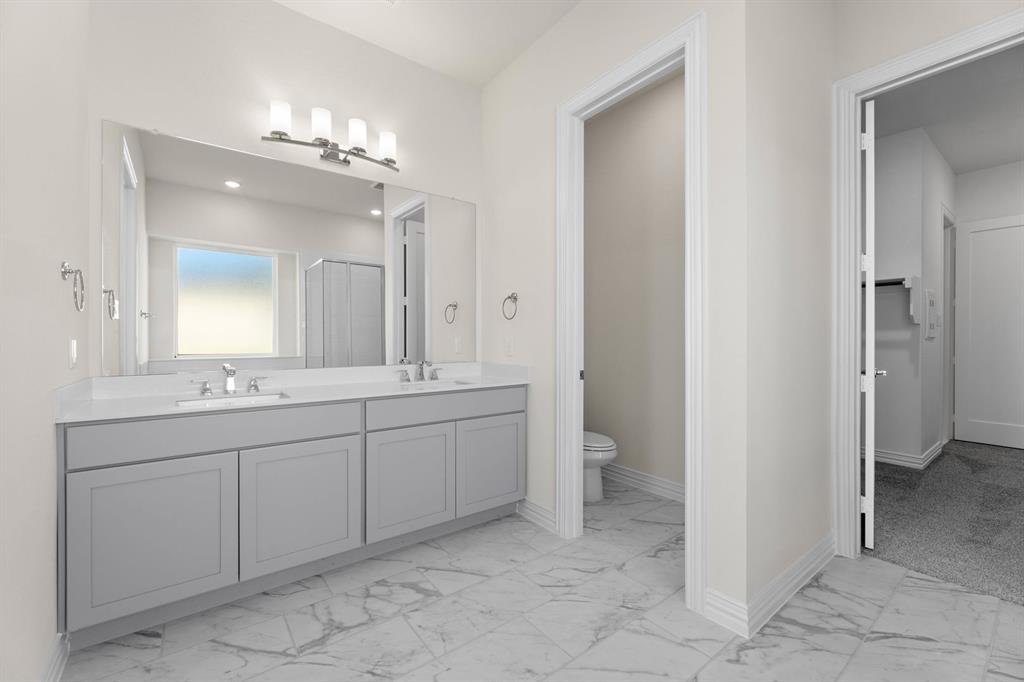 325 Slimp Bluff Azle, TX 76020 - Photo 18 of 25 a spacious bathroom with a granite countertop sink a mirror and a