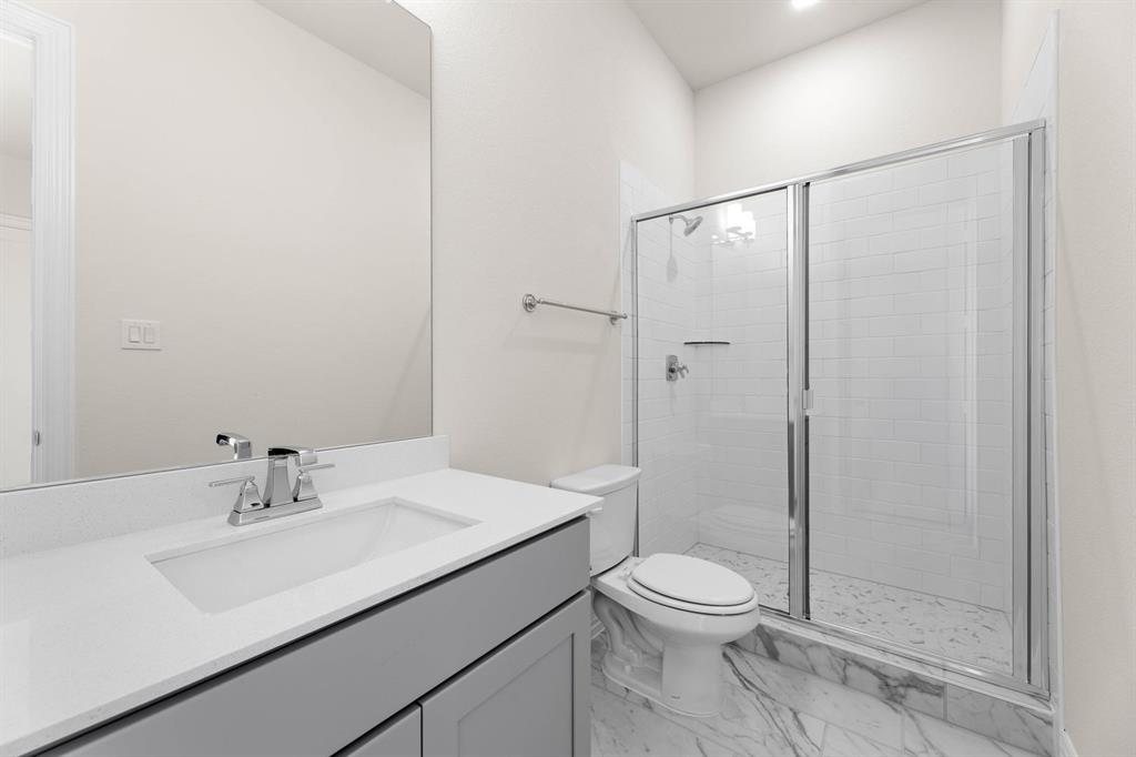 325 Slimp Bluff Azle, TX 76020 - Photo 22 of 25 a bathroom with a sink a toilet and shower