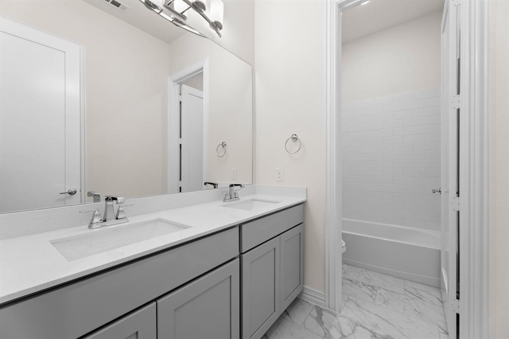 325 Slimp Bluff Azle, TX 76020 - Photo 23 of 25 a bathroom with a sink and a mirror