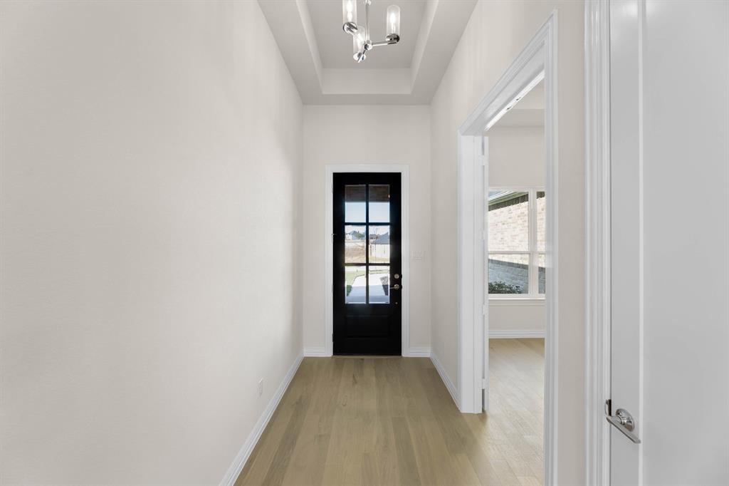 325 Slimp Bluff Azle, TX 76020 - Photo 2 of 25 a view of an empty room with a fireplace and a window