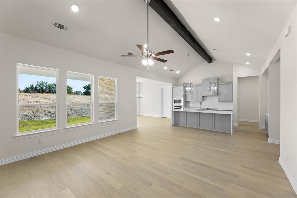 325 Slimp Bluff Azle, TX 76020 - Photo 4 of 25 a view of an empty room with window and cabinet