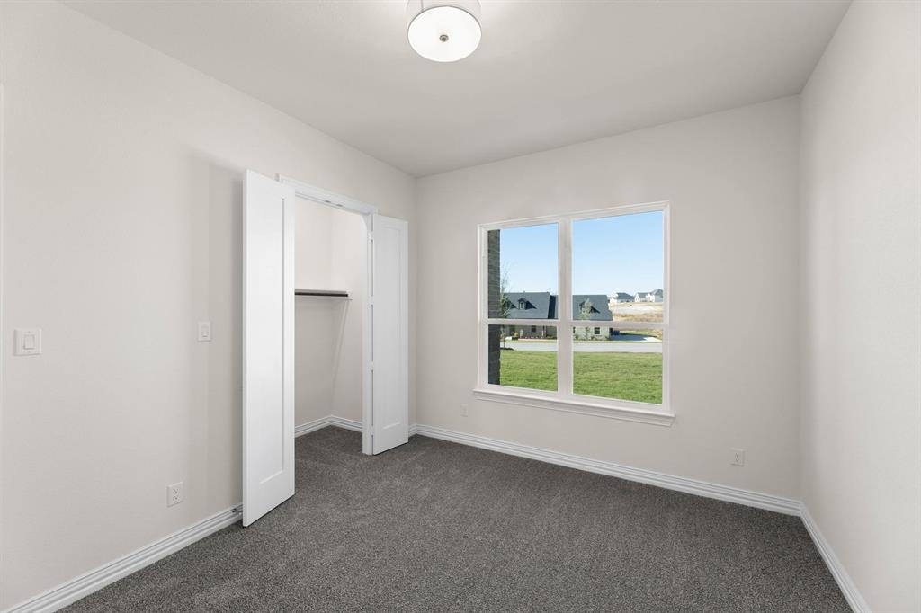 325 Slimp Bluff Azle, TX 76020 - Photo 7 of 25 a view of an empty room with a window