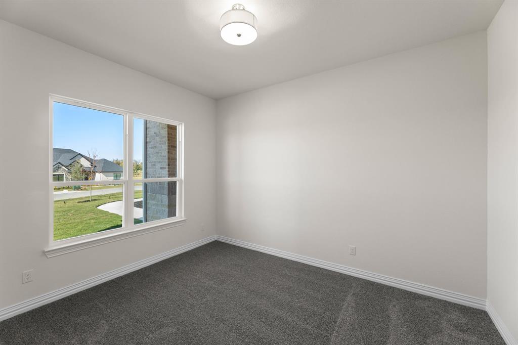 325 Slimp Bluff Azle, TX 76020 - Photo 8 of 25 an empty room with windows