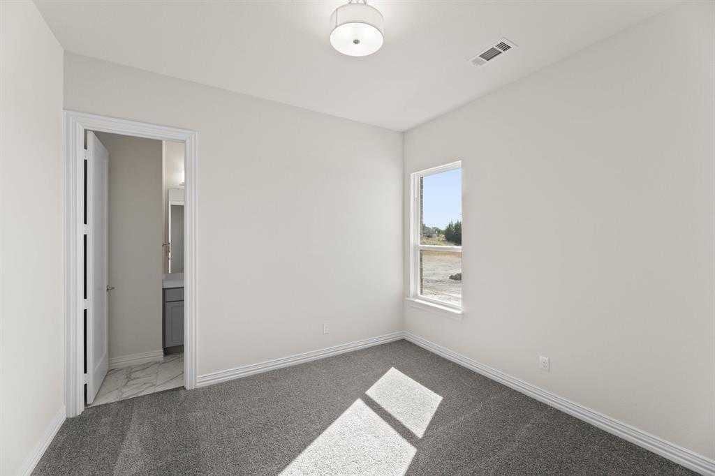 325 Slimp Bluff Azle, TX 76020 - Photo 9 of 25 an empty room with windows