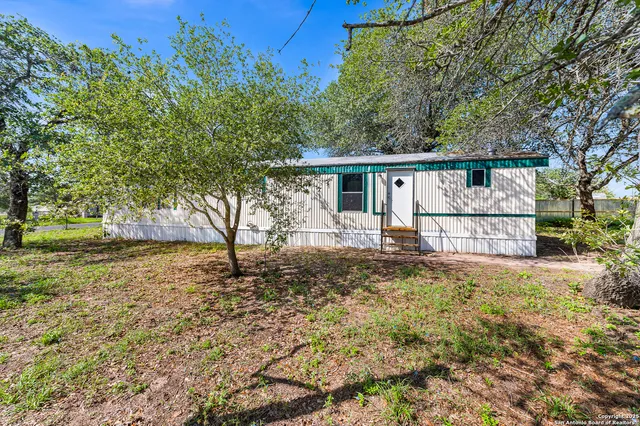 a view of swimming pool with a yard