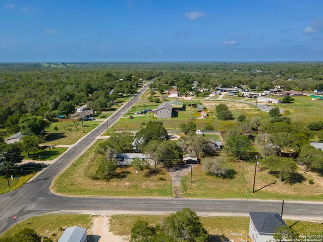 a view of a swimming pool and a yard