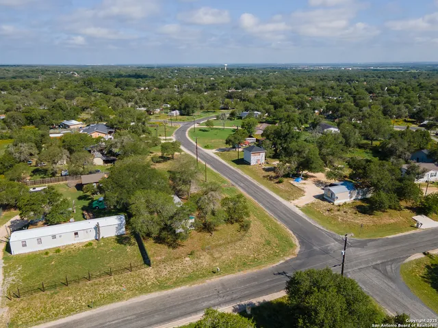 a view of a bench in a backyard