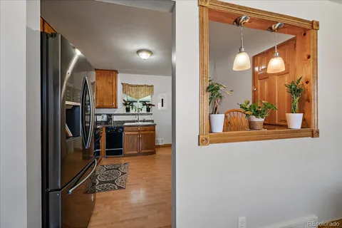a kitchen with a refrigerator and a stove