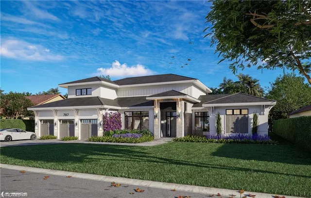 a front view of a house with a garden