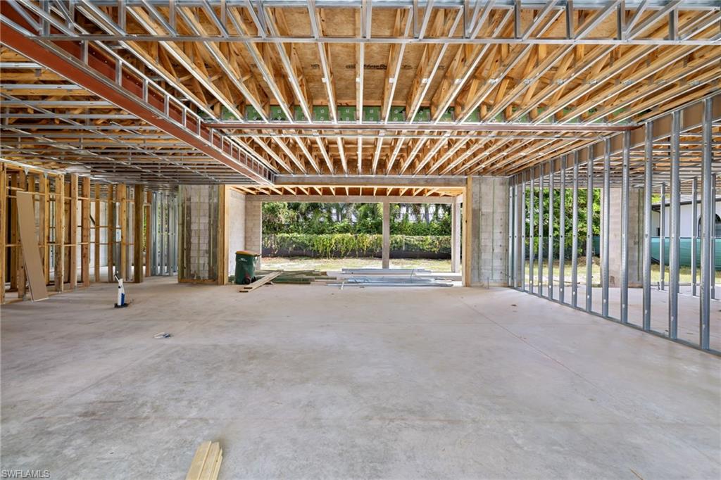 707 Buttonbush Lane Naples, FL 34108 - Photo 16 of 36 View of Great Room and Outdoor Living. Kitchen on Left