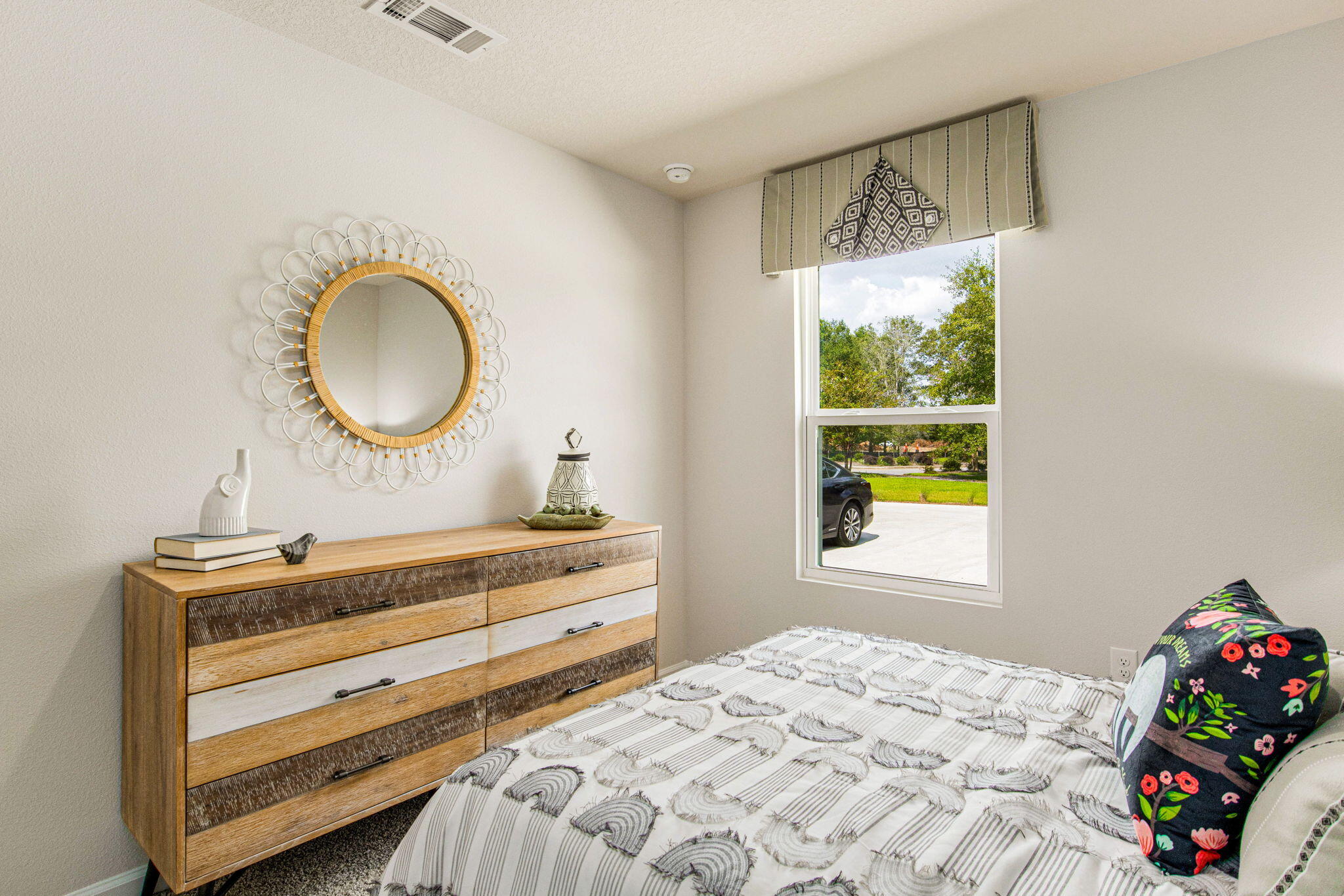 327 Flounder Street Crestview, FL 32539 - Photo 19 of 45 a bedroom with a bed and a window