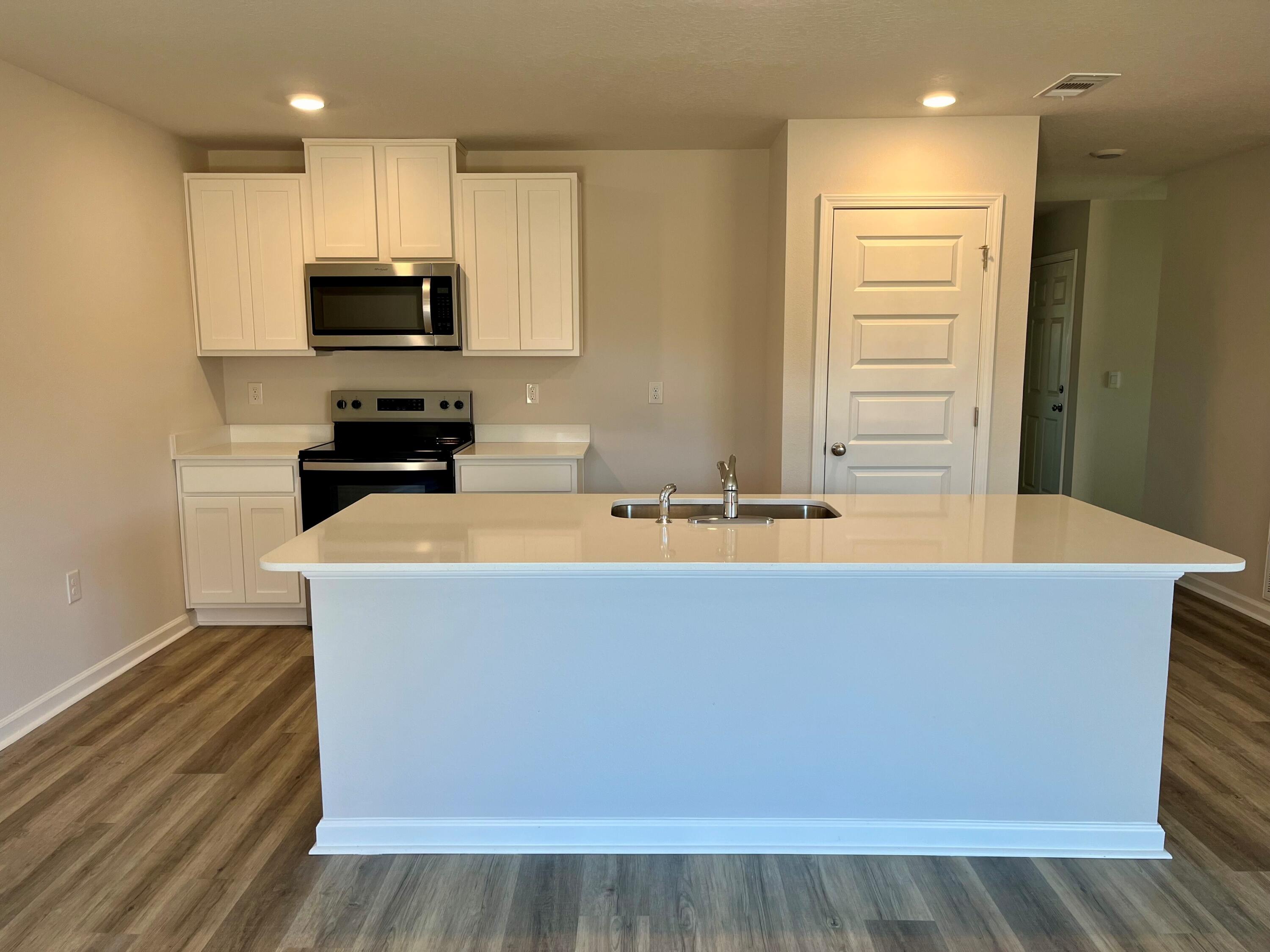 327 Flounder Street Crestview, FL 32539 - Photo 39 of 45 a view of kitchen with stainless steel appliances a refrigerator sink and microwave