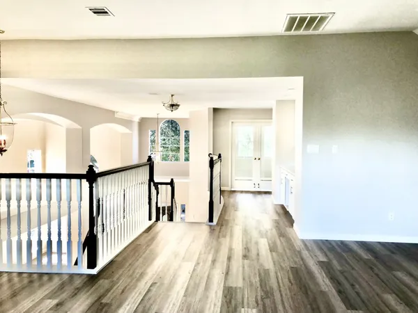 a view of a room with wooden floor and closet