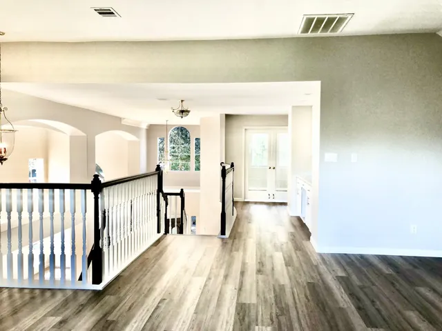 a view of a room with wooden floor and closet