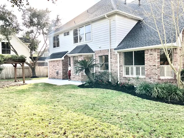 a view of a park with large trees