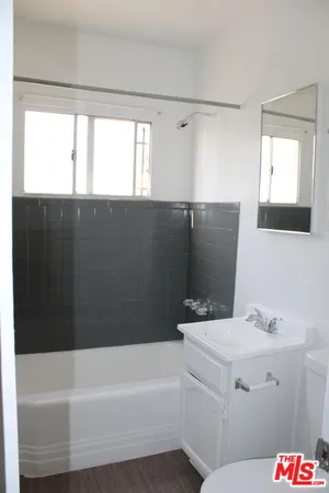 a bathroom with a bathtub and a sink